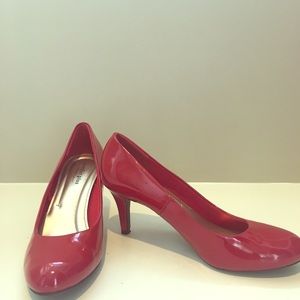 Red patent pumps